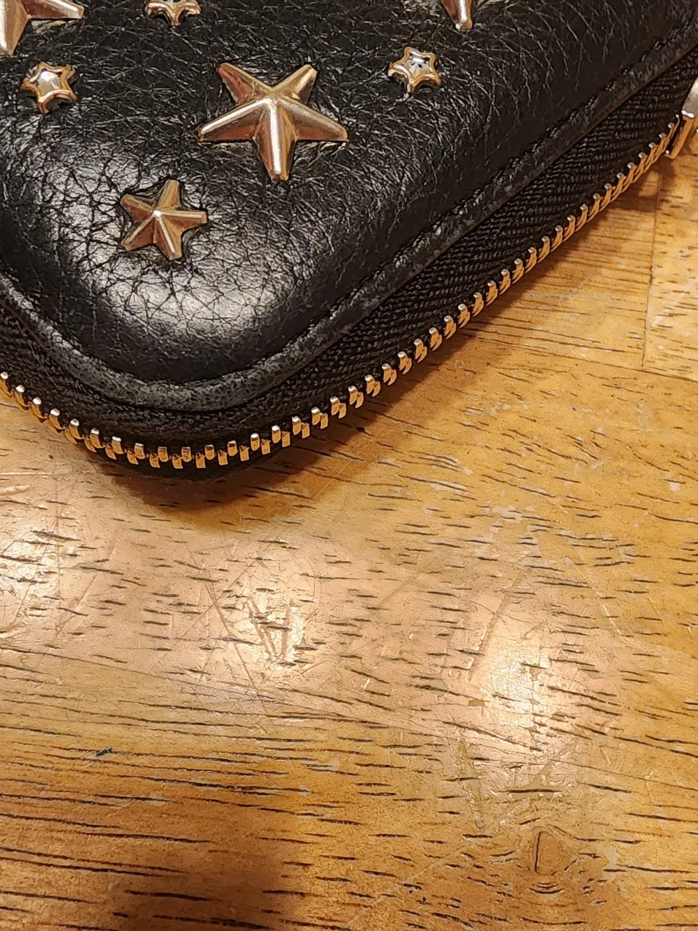 Jimmy Choo Filipa Star Studded Wallet, a black leather zip-around wallet